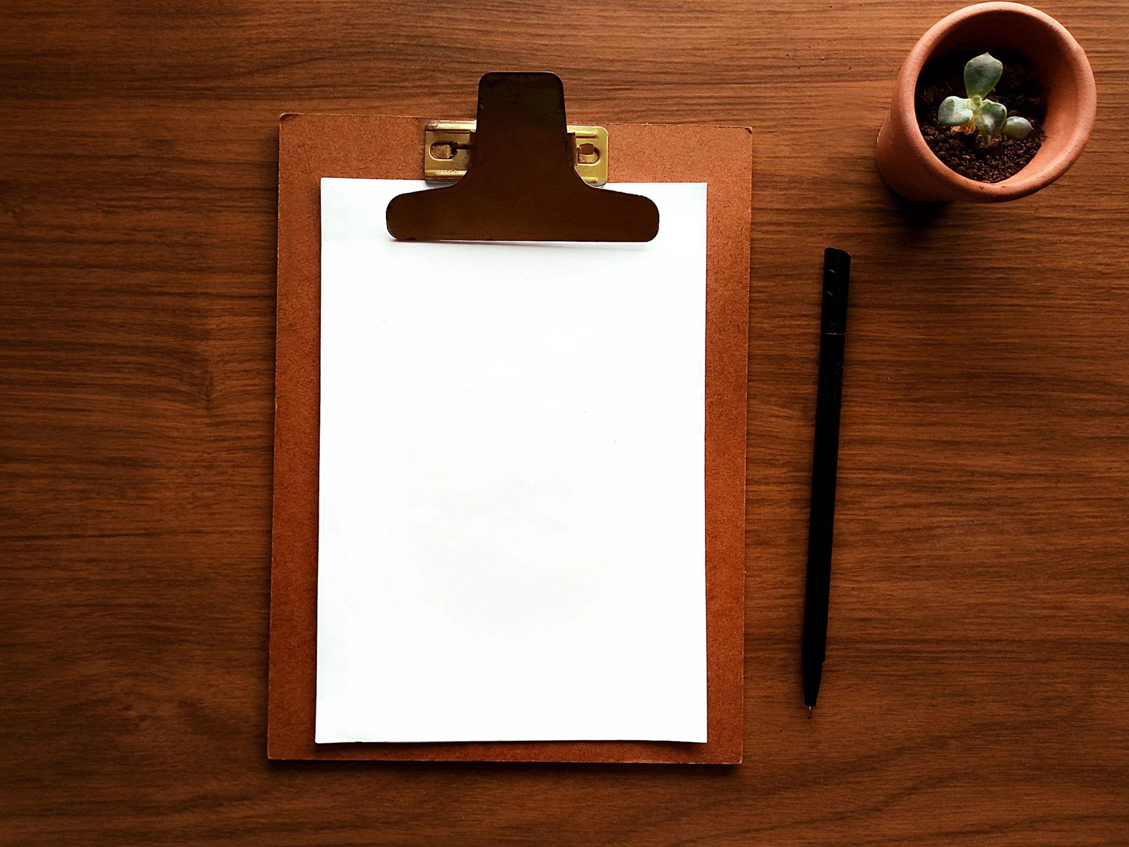 Flat lay of clipboard and stationery for planning a design concept